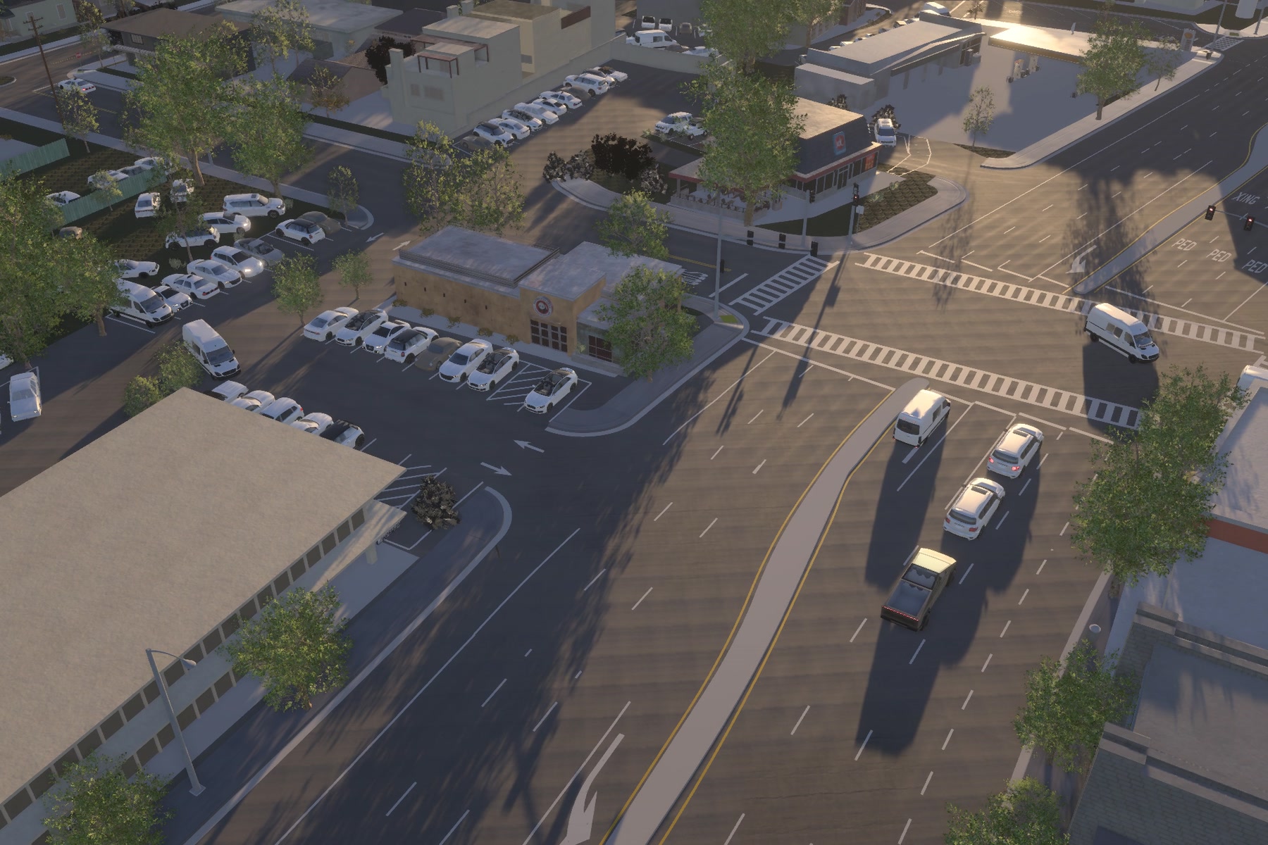 An aerial view of Palo Alto · College Terrace at golden hour: a signalised intersection with crosswalks, cars and long shadows.